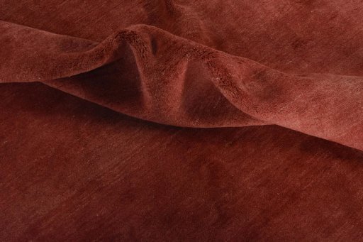Corner detail of New Persian Gabbeh rug showing border pattern and Wool pile
