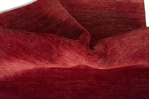 Corner detail of New Persian Gabbeh rug showing border pattern and Wool pile