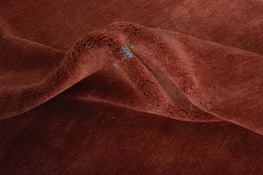Corner detail of New Persian Gabbeh rug showing border pattern and Wool pile