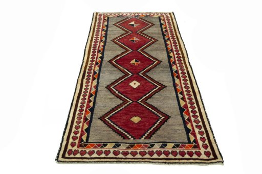 Surface texture of 2000s Persian Gabbeh rug with natural Wool and intricate pattern
