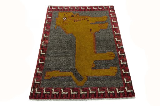 Surface texture of 2000s Persian Gabbeh rug with natural Wool and intricate pattern