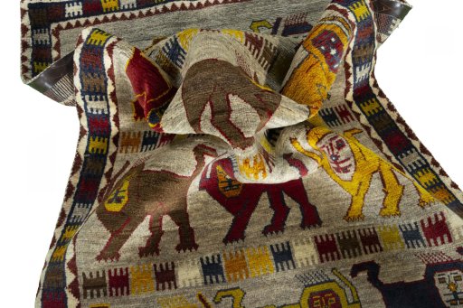 Corner detail of 2000s Persian Gabbeh rug showing border pattern and Wool pile