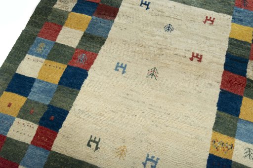 Backside of handmade New Persian Gabbeh rug showing knot structure and weave density