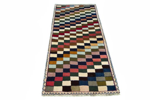 Surface texture of 2000s Persian Gabbeh rug with natural Wool and intricate pattern