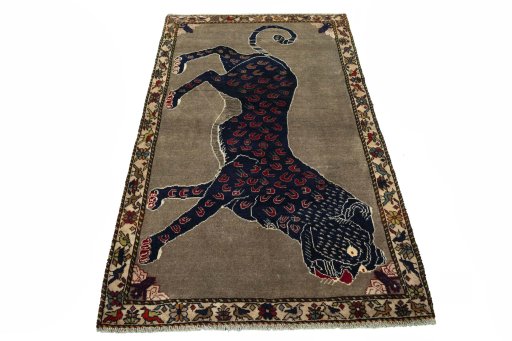 Surface texture of 2000s Persian Gabbeh rug with natural Wool and intricate pattern