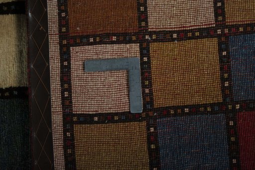 Close-up detail of 2000s Persian Gabbeh rug from Iran / Persia showing Wool weave