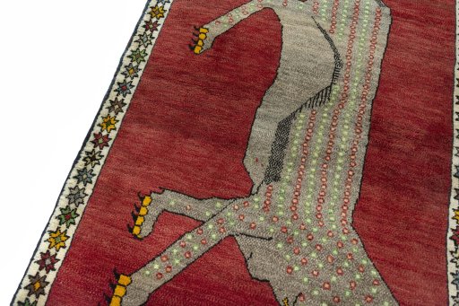 Backside of handmade 2000s Persian Gabbeh rug showing knot structure and weave density