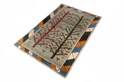 Corner detail of 2000s Persian Gabbeh rug showing border pattern and Wool pile