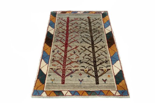 Surface texture of 2000s Persian Gabbeh rug with natural Wool and intricate pattern