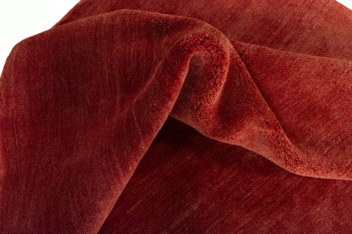 Corner detail of New Persian Gabbeh rug showing border pattern and Wool pile