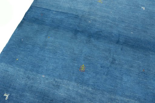 Backside of handmade New Persian Gabbeh rug showing knot structure and weave density