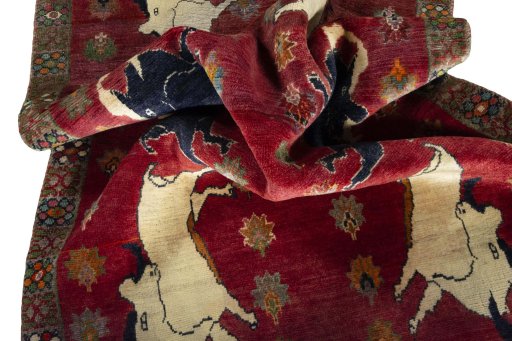 Corner detail of 2000s Persian Gabbeh rug showing border pattern and Wool pile