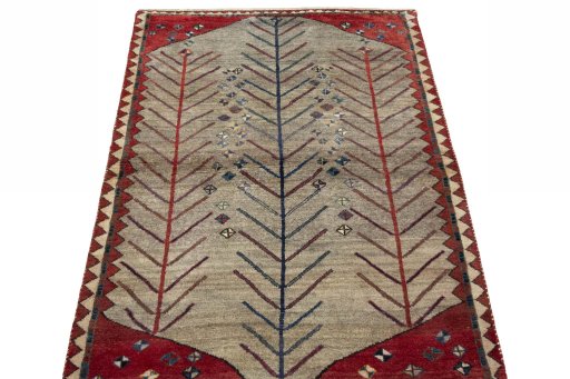 Surface texture of 2000s Persian Gabbeh rug with natural Wool and intricate pattern