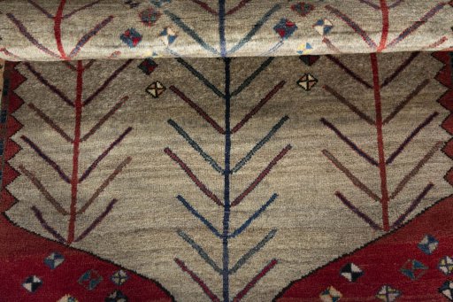 Full view of 2000s Persian Gabbeh rug from Iran / Persia, 150 × 100 cm in Beige tones