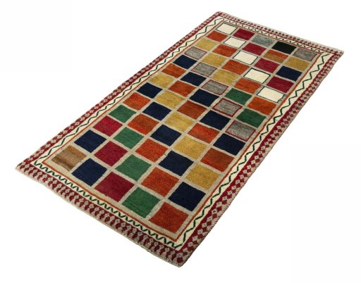 Corner detail of 2000s Persian Gabbeh rug showing border pattern and Wool pile