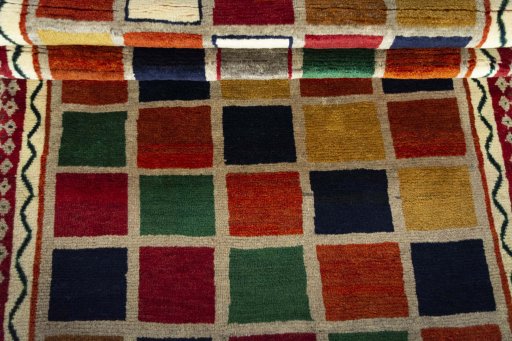 Full view of 2000s Persian Gabbeh rug from Iran / Persia, 212 × 111 cm in Multi Color tones