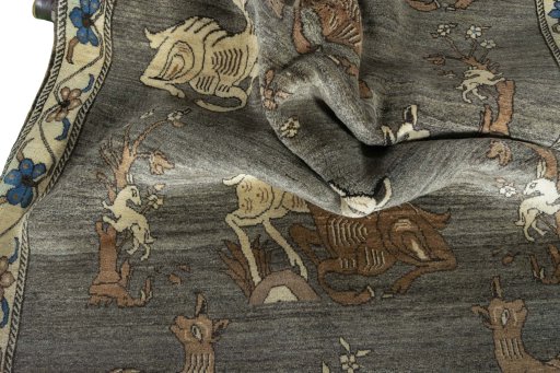 Corner detail of 2000s Persian Gabbeh rug showing border pattern and Wool pile