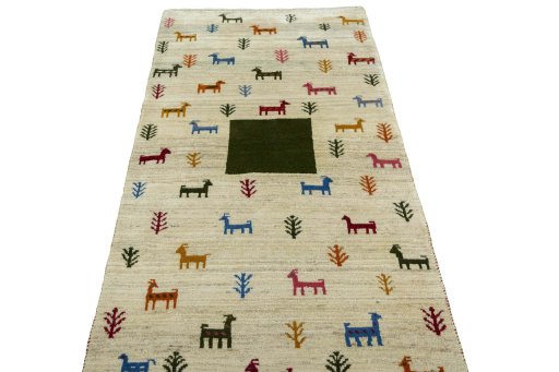 Surface texture of 2000s Persian Gabbeh rug with natural Wool and intricate pattern