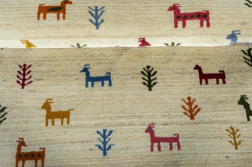 Full view of 2000s Persian Gabbeh rug from Iran / Persia, 200 × 105 cm in Beige tones