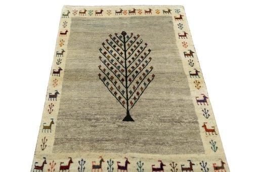 Surface texture of 2000s Persian Gabbeh rug with natural Wool and intricate pattern
