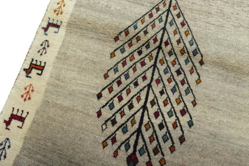 Backside of handmade 2000s Persian Gabbeh rug showing knot structure and weave density