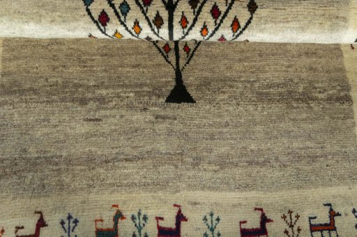 Full view of 2000s Persian Gabbeh rug from Iran / Persia, 150 × 101 cm in Beige tones