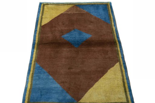 Surface texture of 2000s Persian Gabbeh rug with natural Wool and intricate pattern