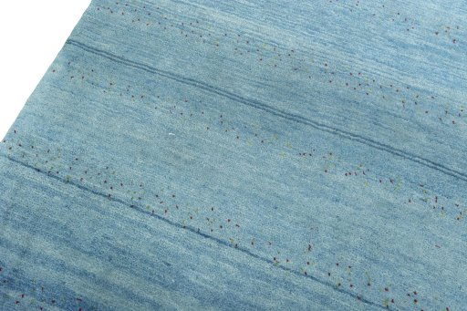 Backside of handmade New Persian Gabbeh rug showing knot structure and weave density