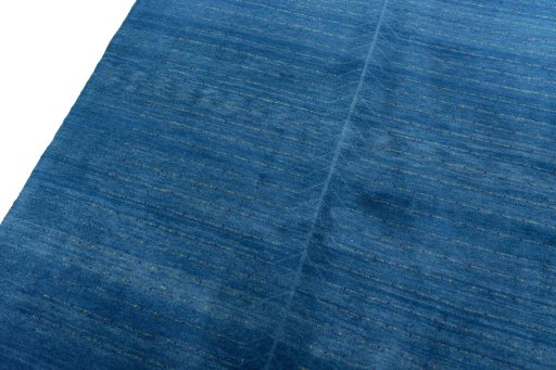 Backside of handmade New Persian Gabbeh rug showing knot structure and weave density