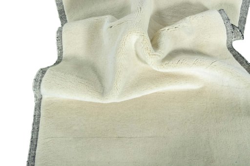 Corner detail of New Persian Gabbeh rug showing border pattern and Wool pile
