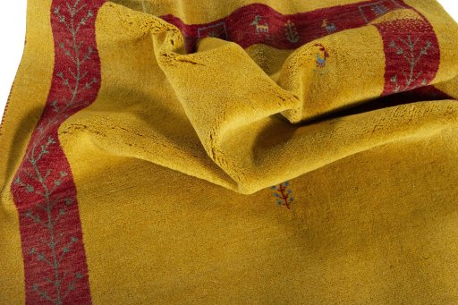 Corner detail of New Persian Gabbeh rug showing border pattern and Wool pile