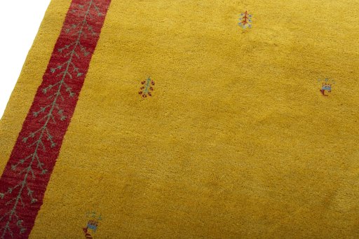 Backside of handmade New Persian Gabbeh rug showing knot structure and weave density