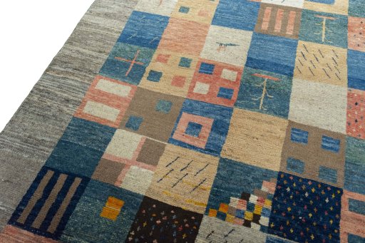 Backside of handmade New Persian Gabbeh rug showing knot structure and weave density