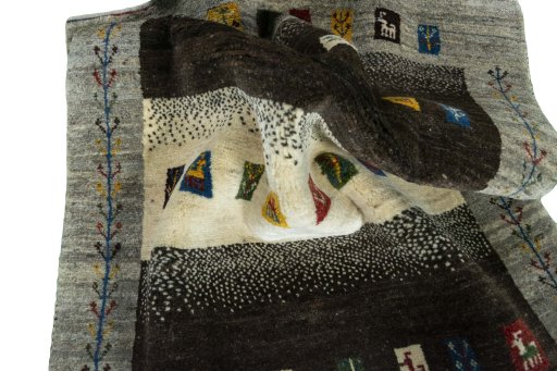 Corner detail of New Persian Gabbeh rug showing border pattern and Wool pile