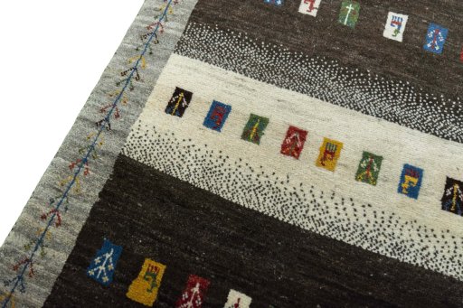 Backside of handmade New Persian Gabbeh rug showing knot structure and weave density