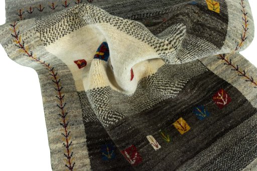 Corner detail of New Persian Gabbeh rug showing border pattern and Wool pile