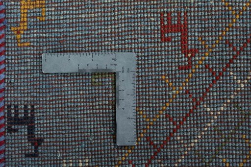 Corner detail of New Persian Gabbeh rug showing border pattern and Wool pile