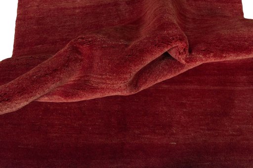 Corner detail of New Persian Gabbeh rug showing border pattern and Wool pile