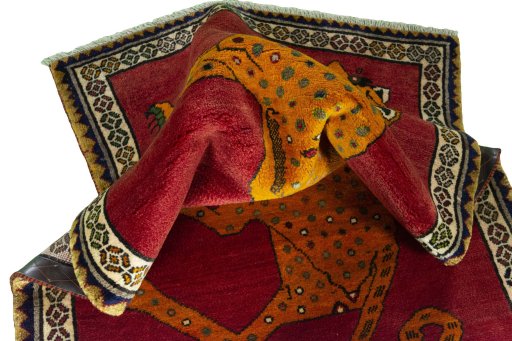 Corner detail of 2000s Persian Gabbeh rug showing border pattern and Wool pile