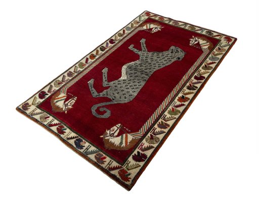 Corner detail of 2000s Persian Gabbeh rug showing border pattern and Wool pile