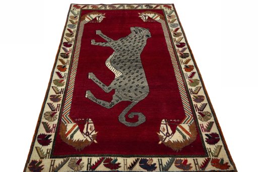 Surface texture of 2000s Persian Gabbeh rug with natural Wool and intricate pattern
