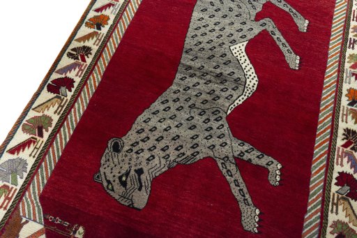 Backside of handmade 2000s Persian Gabbeh rug showing knot structure and weave density