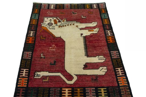 Surface texture of 2000s Persian Gabbeh rug with natural Wool and intricate pattern