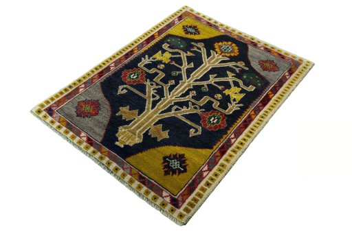 Corner detail of 2000s Persian Gabbeh rug showing border pattern and Wool pile