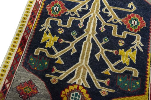 Backside of handmade 2000s Persian Gabbeh rug showing knot structure and weave density
