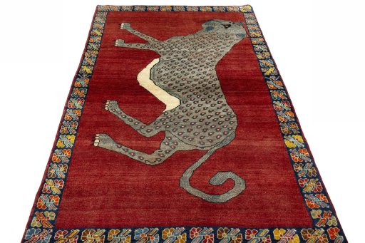 Surface texture of 2000s Persian Gabbeh rug with natural Wool and intricate pattern