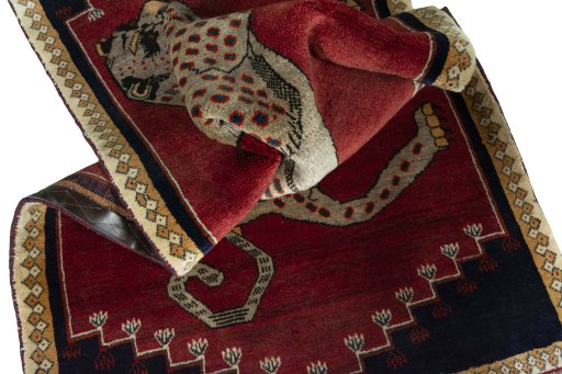 Corner detail of 2000s Persian Gabbeh rug showing border pattern and Wool pile