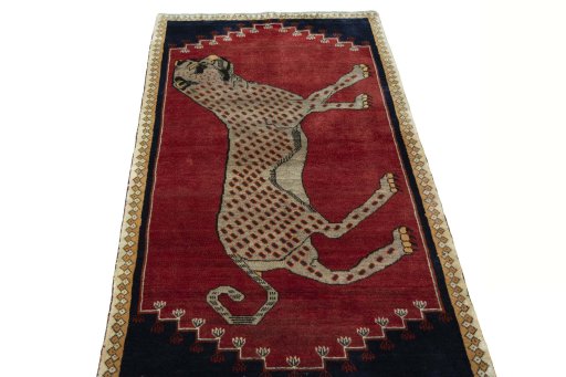 Surface texture of 2000s Persian Gabbeh rug with natural Wool and intricate pattern