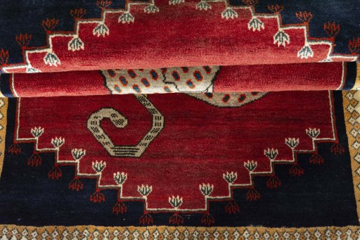 Full view of 2000s Persian Gabbeh rug from Iran / Persia, 190 × 105 cm in Red tones