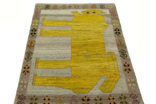 Surface texture of 2000s Persian Gabbeh rug with natural Wool and intricate pattern